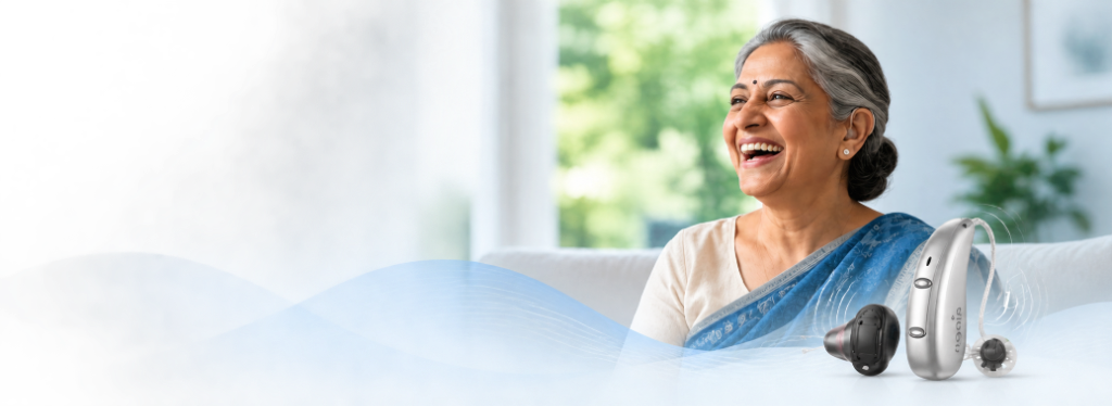 Sanskara Hearing Solutions - Senior Indian woman smiling with hearing aid and acoustic waves